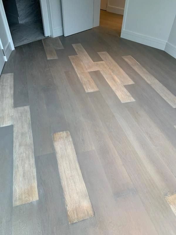 Herringbone hardwood floor installation in progress
